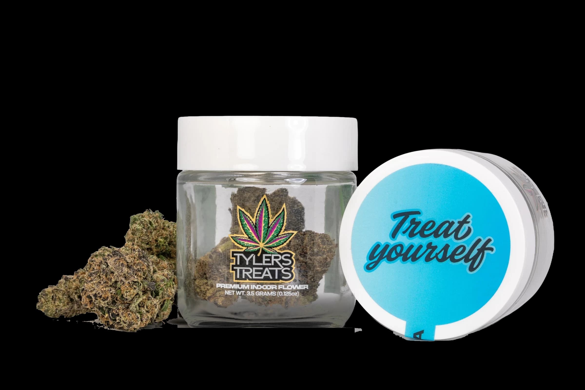 Tyler’s Treats 3.5g Indica jar with its blue lid and a whole flower bud